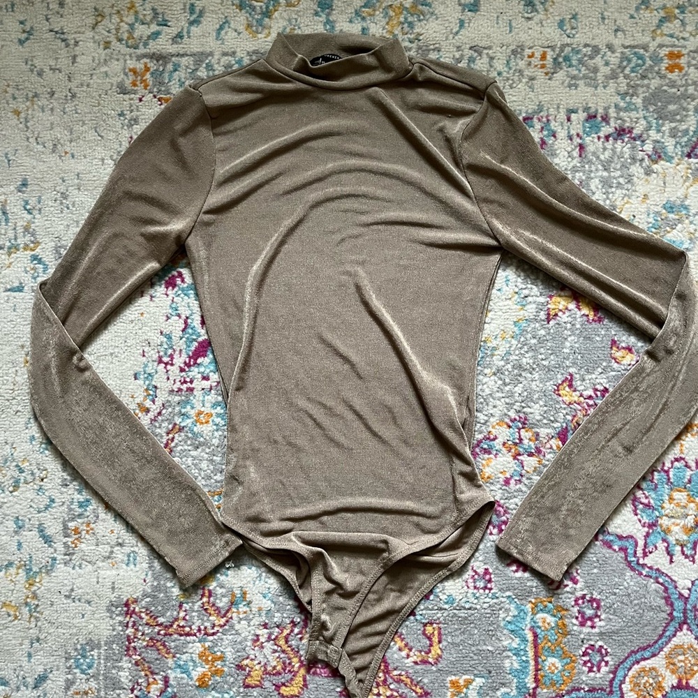 Mock neck long sleeved tan bodysuit